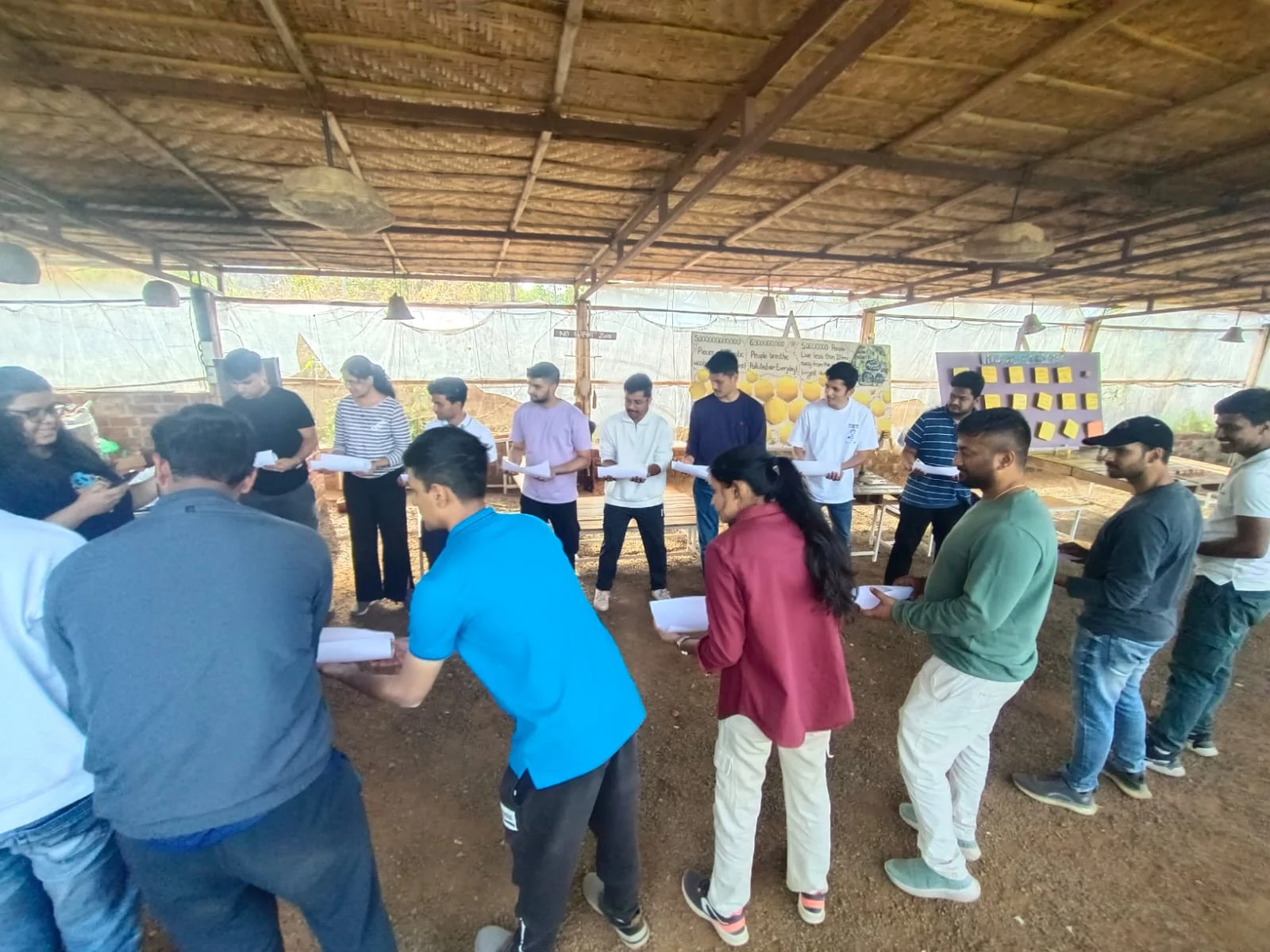 Team members in a circle during an outdoor team game